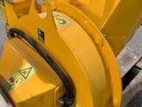 a yellow machine that is sitting on the side of the street