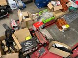 many boxes of assorted items sitting on the floor