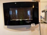 a television mounted on the wall in a kitchen