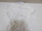 white shirt on a white table with a tag on it
