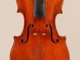 an old violin with a bow hanging from it ' s back