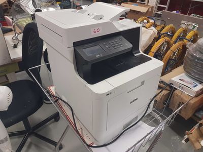 a printer that is sitting on top of a chair