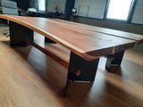 a large wooden table in the middle of a room