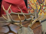 a wooden table with antlers on top of it