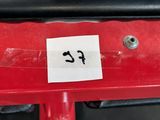 a sticker that says f2 on the back of a red bicycle