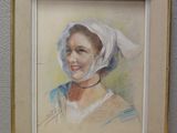 tableau représentant une femme portant un foulard blanc, dans un cadre doré