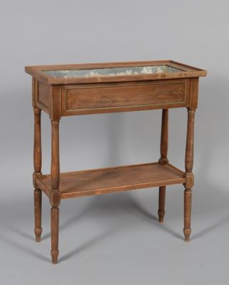 a small wooden table with a glass top on it