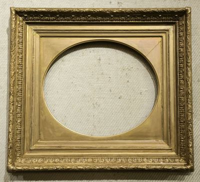 a gold picture frame with a white background