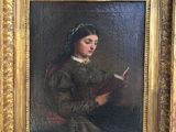 tableau représentant une femme en train de lire un livre, dans un cadre doré
