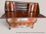 a wooden desk with a mirror on top of it