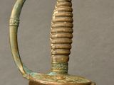 a close up of a sword with a handle