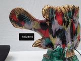 a statue of a fish that is sitting on a table