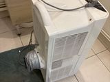 an image of a small air conditioner sitting on the floor