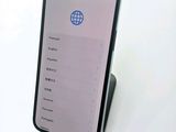 a phone that is sitting on top of a stand