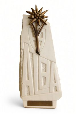 a white sculpture with a star on top of it