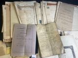 a pile of old papers that are on a table