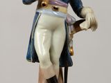 a figurine of a man in a military uniform on a table