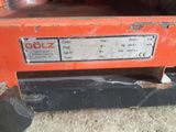 a close up of a machine that is sitting on the ground