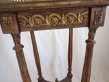 a wooden table with a mirror on top of it