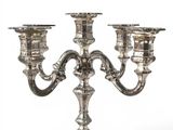 silver plated candelabra with three candles on a stand