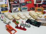a lot of toy vehicles that are sitting on a table