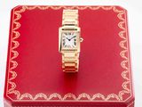 an image of a red box with a gold watch on it