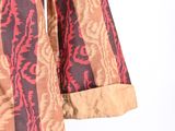 an image of a woman ' s dress with a red and brown pattern