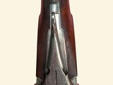 a close up of a gun with a wooden case