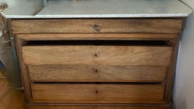 a wooden dresser with a mirror on top of it