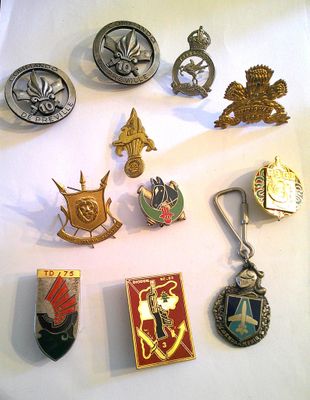 a lot of badges that are on a table