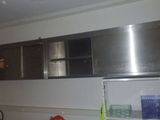 an image of a kitchen with stainless steel cabinets
