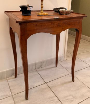 a small table with a lamp on top of it