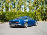a blue sports car parked on the side of the road