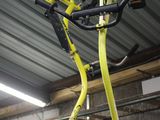 a bike hanging from the ceiling in a garage