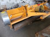 a yellow machine that is sitting in a garage