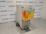 une machine sur laquelle est représentée une orange