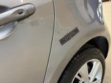 a close up of a car door handle with a sticker on it