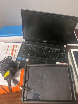 a laptop and a tablet sitting on a desk