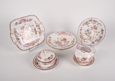 four pieces of porcelainware including a bowl, saucer, and plate