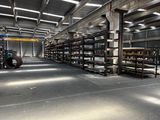 a large warehouse filled with lots of shelves and pallets