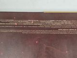 the back of a book with a picture of a person holding a knife