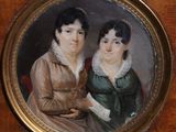 tableau représentant deux femmes en robe verte assises sur une table en bois