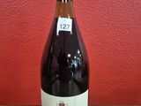 a bottle of wine that is sitting on a table