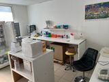 an image of a lab with a refrigerator and a chair