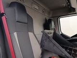 a view of the inside of a truck with the driver ' s seat up