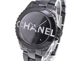 a black watch with a chanel logo on it
