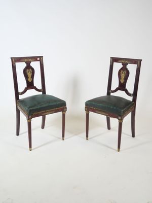 pair of antique mahogany chairs with green upholstered leather seats