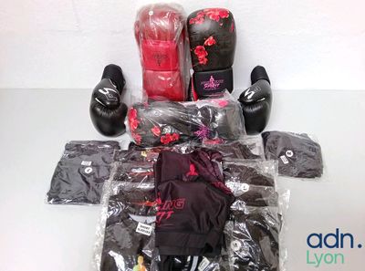 several pairs of boxing gloves, gloves, gloves, gloves, and other items