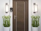 two planters that are next to a door in a room