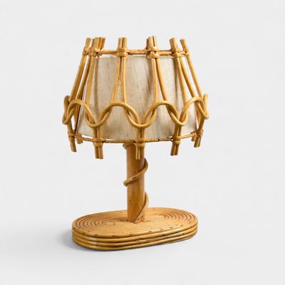 a lamp that is made out of bamboo sticks and a lamp shade